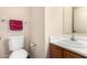 Well-maintained half bathroom featuring a toilet and sink at 125 S 56Th St # 100, Mesa, AZ 85206