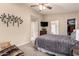 Comfortable bedroom with neutral walls, ceiling fan, tv, and a closet at 125 S 56Th St # 100, Mesa, AZ 85206