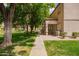 Exterior view of home buildings, landscape, and walking path in the community at 125 S 56Th St # 100, Mesa, AZ 85206