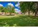 Well-manicured green lawn and trees in a community area between the buildings at 125 S 56Th St # 100, Mesa, AZ 85206