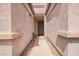 The entryway features a walkway between two walls that are the same color as the garage at 125 S 56Th St # 100, Mesa, AZ 85206