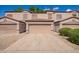 Inviting townhome featuring a private garage, neutral stucco, and a tile roof creating great curb appeal at 125 S 56Th St # 100, Mesa, AZ 85206