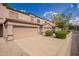 Charming townhome with neutral stucco, tile roof, private garage, and well-maintained landscaping at 125 S 56Th St # 100, Mesa, AZ 85206