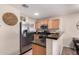 Well-equipped kitchen with stainless steel appliances and a breakfast bar that is perfect for casual dining at 125 S 56Th St # 100, Mesa, AZ 85206