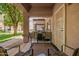 View of a covered patio space equipped with outdoor seating and a BBQ grill at 125 S 56Th St # 100, Mesa, AZ 85206