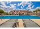 Relaxing community pool with shallow lounge area, sun loungers, and clear water for residents to unwind and socialize at 125 S 56Th St # 100, Mesa, AZ 85206