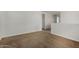 Large open carpeted bonus room space with access to hallway and natural light at 13749 W Amberwing St, Peoria, AZ 85383