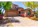Charming two-story home featuring a well-manicured front yard and a two car garage at 13749 W Amberwing St, Peoria, AZ 85383