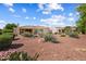Home exterior with desert landscaping, covered patio, and views of neighboring properties at 13841 W Nogales Dr, Sun City West, AZ 85375