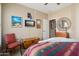 Bedroom with ceiling fan, artwork, TV, and comfortable furnishings at 13841 W Nogales Dr, Sun City West, AZ 85375