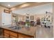 Bright kitchen with a view of the living area, creating a seamless flow for modern living at 13841 W Nogales Dr, Sun City West, AZ 85375