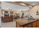 Open-concept kitchen overlooking the living and dining areas, perfect for entertaining guests at 13841 W Nogales Dr, Sun City West, AZ 85375
