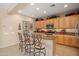 Stylish kitchen featuring a breakfast bar, modern appliances, and plenty of cabinet space at 13841 W Nogales Dr, Sun City West, AZ 85375