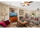 Bright living room with a fireplace, comfortable seating, and neutral decor for a relaxing atmosphere at 13841 W Nogales Dr, Sun City West, AZ 85375