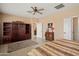 Comfortable main bedroom with a ceiling fan and ample space for relaxation and personalization at 13841 W Nogales Dr, Sun City West, AZ 85375
