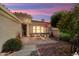 Relaxing patio with brick pavers, outdoor seating, and beautifully landscaped yard at 13841 W Nogales Dr, Sun City West, AZ 85375