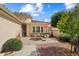 Relaxing patio with brick pavers, outdoor seating, and beautifully landscaped yard at 13841 W Nogales Dr, Sun City West, AZ 85375