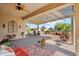 Outdoor patio with landscaping, seating, shade structure, and beautiful views at 13841 W Nogales Dr, Sun City West, AZ 85375
