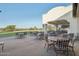 Spacious outdoor patio with ample seating, perfect for dining and enjoying the scenic views at 13841 W Nogales Dr, Sun City West, AZ 85375