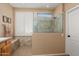 Modern bathroom featuring walk-in shower with glass partition and tile accents at 13841 W Nogales Dr, Sun City West, AZ 85375