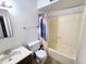 Bathroom features a standard bathtub, shower, toilet, and vanity with a large mirror at 141 N Date -- # 7, Mesa, AZ 85201