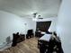 Simple bedroom with hardwood floors and ceiling fan at 141 N Date -- # 7, Mesa, AZ 85201