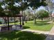 Enjoy a relaxing afternoon at the community park with lush greenery and charming picnic area at 141 N Date -- # 7, Mesa, AZ 85201