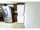 Kitchen featuring a stainless steel refrigerator and stacked washer and dryer for added convenience at 141 N Date -- # 7, Mesa, AZ 85201