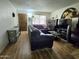 Cozy living room features hardwood floors, comfortable seating, and natural light, creating an inviting atmosphere at 141 N Date -- # 7, Mesa, AZ 85201