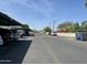 Large community parking area with ample space for residents and visitors at 141 N Date -- # 7, Mesa, AZ 85201