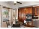 Cozy dining area features custom wood cabinets, modern appliances, and plenty of natural light at 1515 E Saratoga Ct, Gilbert, AZ 85296