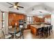 Gourmet kitchen featuring custom cabinets, granite countertops, stainless steel appliances, and a central island with seating at 1515 E Saratoga Ct, Gilbert, AZ 85296