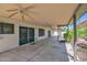 A spacious covered patio with ceiling fans, offering an ideal outdoor living space at 1617 E Fremont Rd, Phoenix, AZ 85042