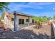 Backyard featuring a covered patio, desert landscaping, and access to outdoor living at 1617 E Fremont Rd, Phoenix, AZ 85042