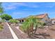 View of backyard featuring desert landscaping, hot tub and covered patio at 1617 E Fremont Rd, Phoenix, AZ 85042
