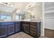Bright bathroom featuring dual vessel sinks, granite counters, and dark wood cabinetry at 1617 E Fremont Rd, Phoenix, AZ 85042