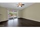 Bright bedroom with hardwood floors and sliding door to patio at 1617 E Fremont Rd, Phoenix, AZ 85042