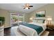 Inviting bedroom with hardwood floors, a ceiling fan, and a patio access at 1617 E Fremont Rd, Phoenix, AZ 85042