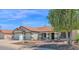 Inviting single-story home with a tile roof and landscaped front yard at 1617 E Fremont Rd, Phoenix, AZ 85042
