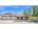 Charming single-story home featuring a well-maintained yard and a two-car garage at 1617 E Fremont Rd, Phoenix, AZ 85042
