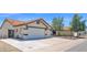 Spacious three-car garage and driveway offer ample parking at 1617 E Fremont Rd, Phoenix, AZ 85042