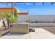 Backyard patio with a well-maintained hot tub and desert landscaping at 1617 E Fremont Rd, Phoenix, AZ 85042