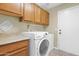 Laundry room with washer, dryer and cabinets at 1617 E Fremont Rd, Phoenix, AZ 85042