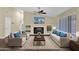 Living room with a fireplace, hardwood floors, and large windows at 1617 E Fremont Rd, Phoenix, AZ 85042