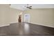 Open living space with modern flooring, a ceiling fan and natural light at 1617 E Fremont Rd, Phoenix, AZ 85042