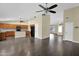 Open concept living space featuring a modern kitchen with island and living area with a fireplace at 1617 E Fremont Rd, Phoenix, AZ 85042