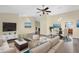 Spacious living room with hardwood floors, a ceiling fan, and neutral walls at 1617 E Fremont Rd, Phoenix, AZ 85042
