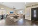Bright living room features high ceilings, hardwood floors, and large windows to view backyard at 1617 E Fremont Rd, Phoenix, AZ 85042