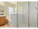 Bathroom featuring glass enclosed shower, tub, vanity and tile flooring at 16228 W Crocus Dr, Surprise, AZ 85379