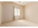 Cozy bedroom with a window and neutral-toned walls, offering a serene atmosphere at 16228 W Crocus Dr, Surprise, AZ 85379